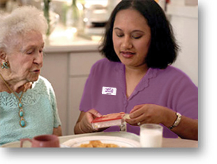 Caregiver assisting at mealtime